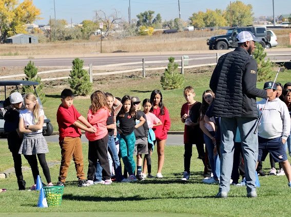 Davyon Collins, right, works with a group of kids at a Golf in Schools event Oct. 18 at Thorncreek Golf Course in Thornton. Collins, a Houston native, was recently selected to serve as the second-ever PGA WORKS Fellow for the Colorado PGA Section, which is based in Larkspur.